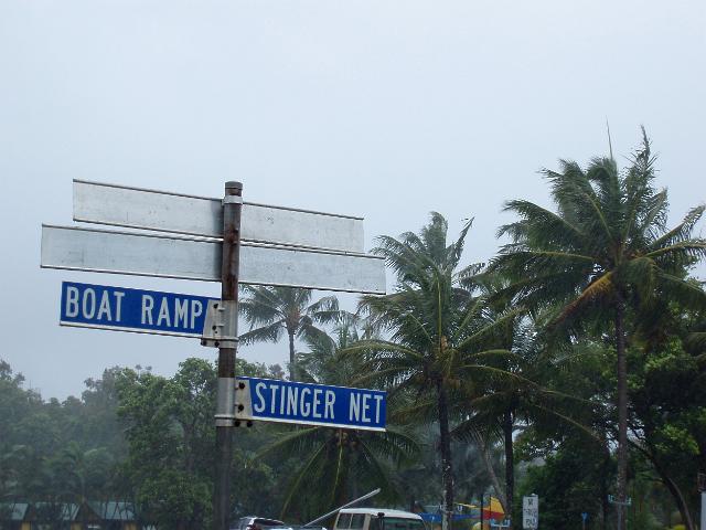 signs to the stinger net and boat ramp on a rainy day at mission beach, FNQ