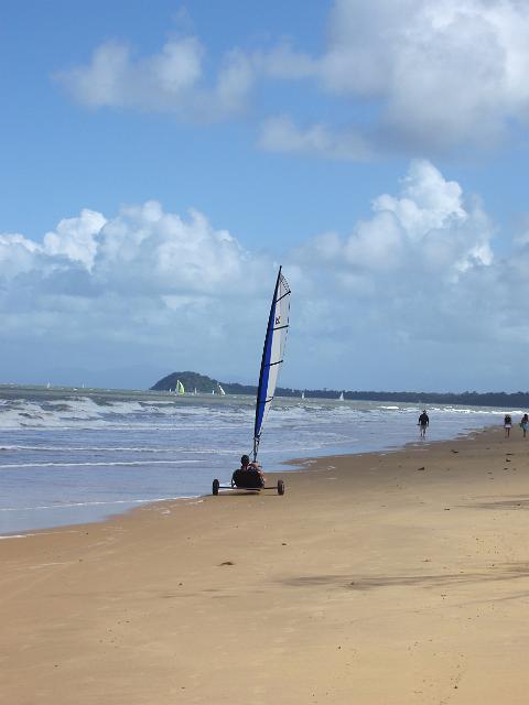 rinding a sail cart along the beach front at mission beach, north queensland