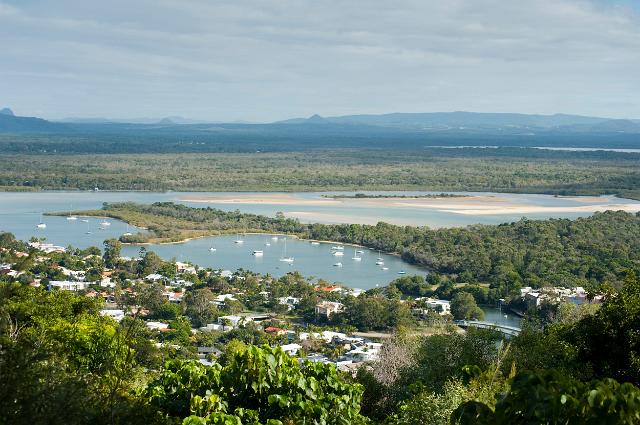 Noosa panorama with an aerial view over the estuary and basins of the Noosa River in Queensland and the resort town nestling amongst tropical foliage on its banks