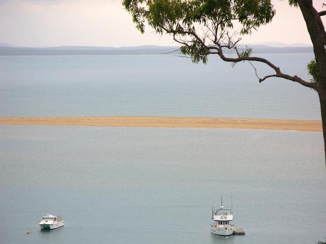 boats moored behind the sandbar at town of 1770, queensland