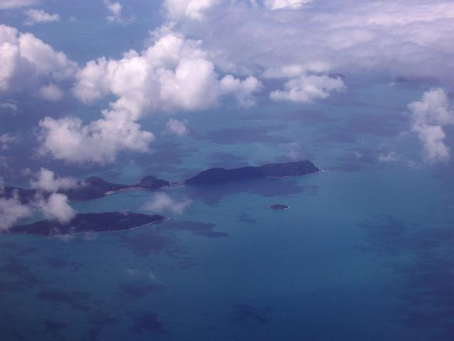viewed from the air, blacksmith and hammer islands shrouded in clouds, whitsunday islands, queensland