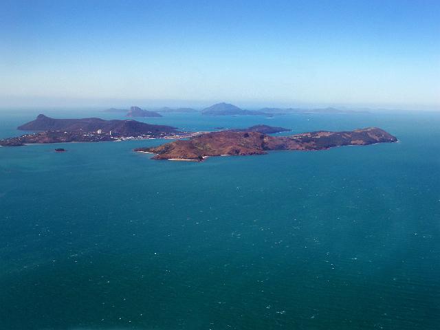 dent island, with hamilton island, pentecost island the the lindeman group to the rear