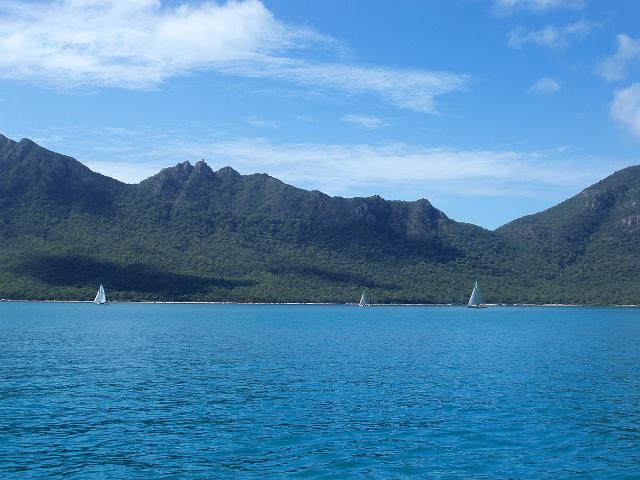 boats sailing off the coast of gloucester island