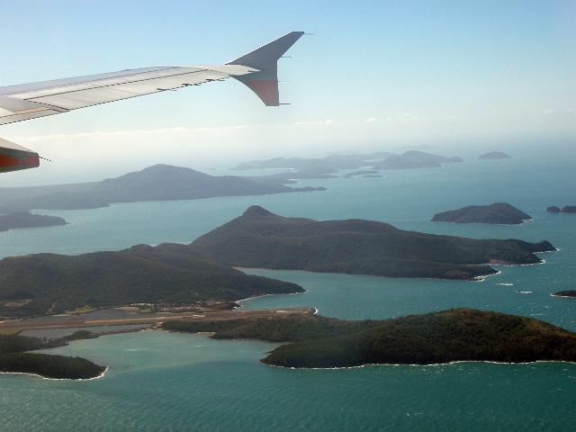 an aerial view of hamilton island and airport runway in the whitsunday island group, queensland