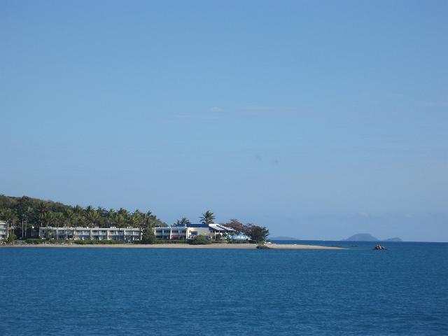 a view of the beach and resort buildings at the north end of daydream island