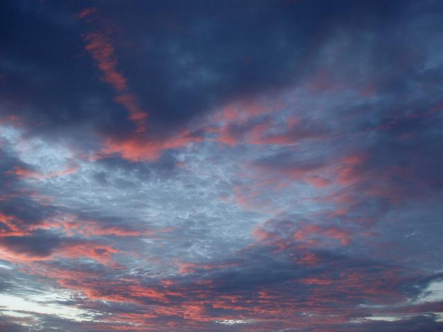 a salmon pink sunset sky at airlie beach, north queensland