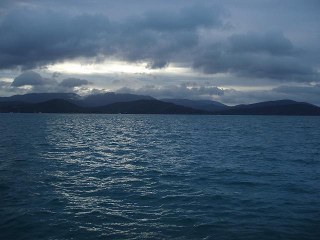 a stormy sky over pioneer bay, airlie beach, whitsundays