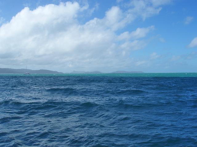 an open expanse of water and a sailing boat, whitsunday passage