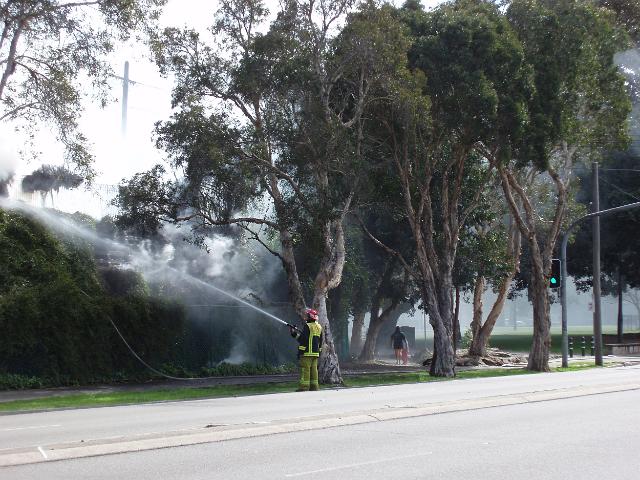 the australian fire service fire-ies putting a bush fire out