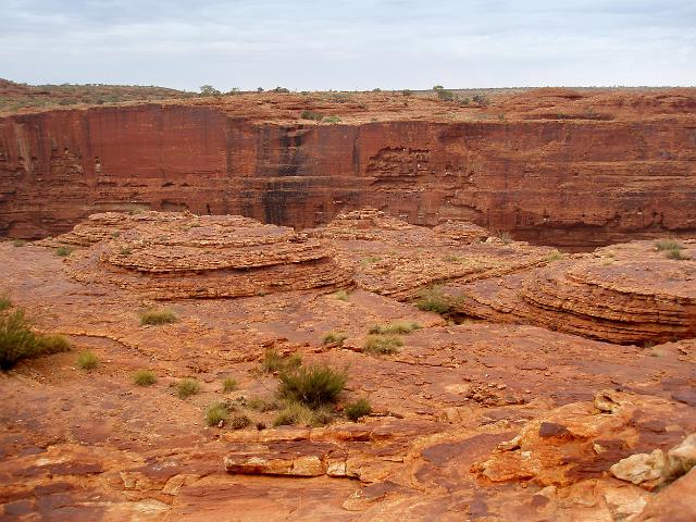 a view of the sheer vertical cliffs and eroded rock domes on the rim of kings canyon,