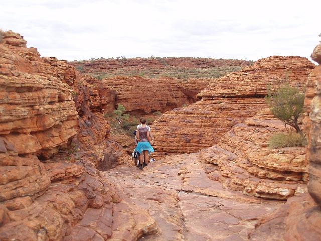 walking through eroded sandstone domes known as the lost city, kings canyon, NT