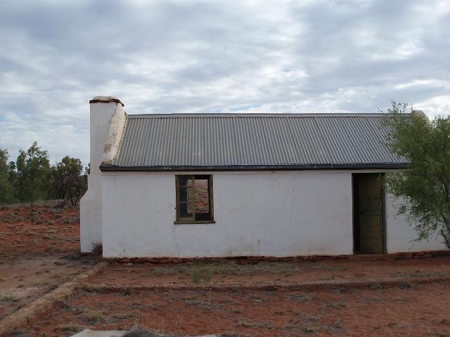 views of a small abandoned house in the desert