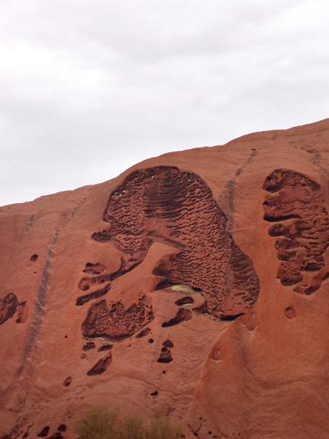 rock erosion on the side of ayres rock which looks like a head in profile