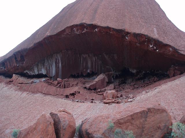 rock erosion at uluru ayres rock forms a cave in the cliff face