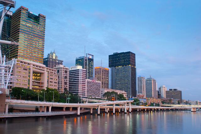 Waterfront view of central Brisbane showing the modern architecture and skyscrapers of the CBD reflected in the water