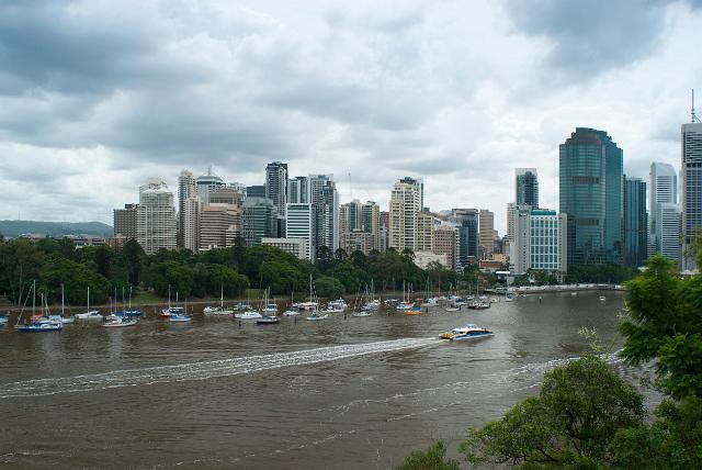 Brisbane city centre from Kangaroo Point with small pleasure boats and yachts moored in the Brisbane River in the foreground with the city skyline behind