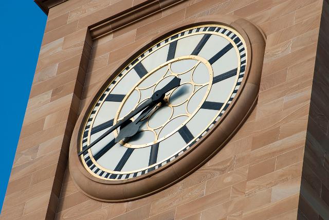 Closeup detail of the dial of the clock on the stone clock tower of the City Hall, Brisbane