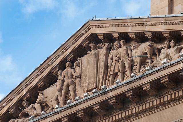Brisbane City Hall architectural detail showing detail of the stone carved frieze on the facade