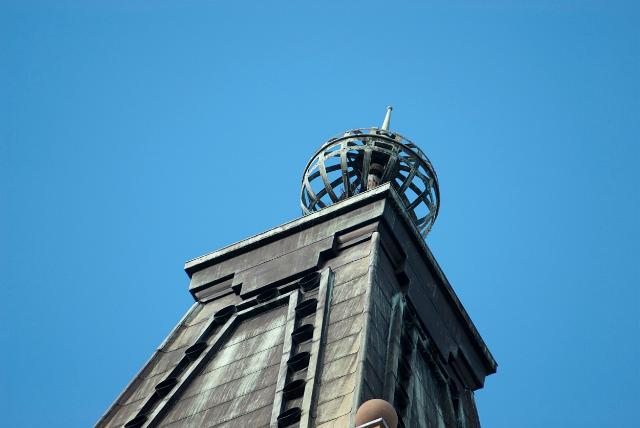 Brisbane City Hall Clock Tower showing the detail of the lattice sphere on top against a clear blue sky