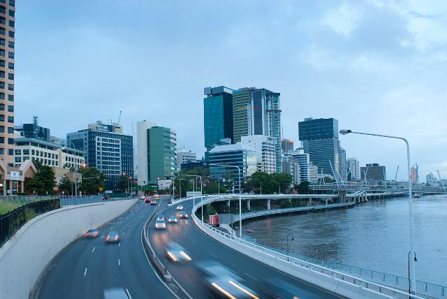 Traffic on Coronation Drive, Brisbane with commuters traveling home along the banks of the river at dusk leaving the CBD