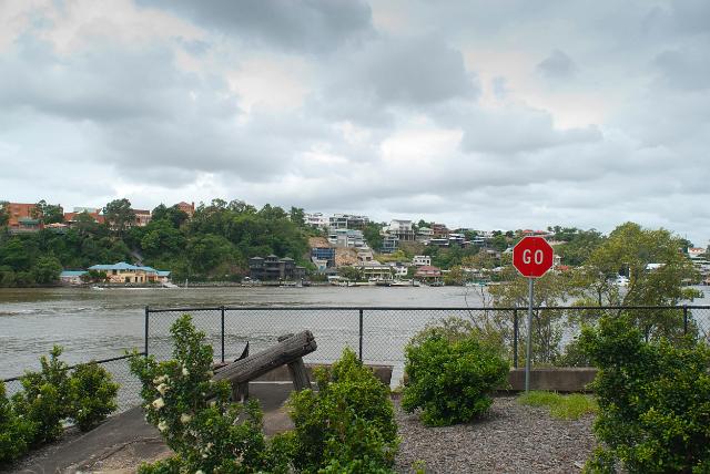 View of the Brisbane River from a lookout point along the bank with houses nestled amongst green trees