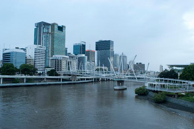 Brisbane River waterfront with the Kurilpa pedestrian bridge in the foreground of the modern architecture of the CBD, Brisbane, Queensland, Australia