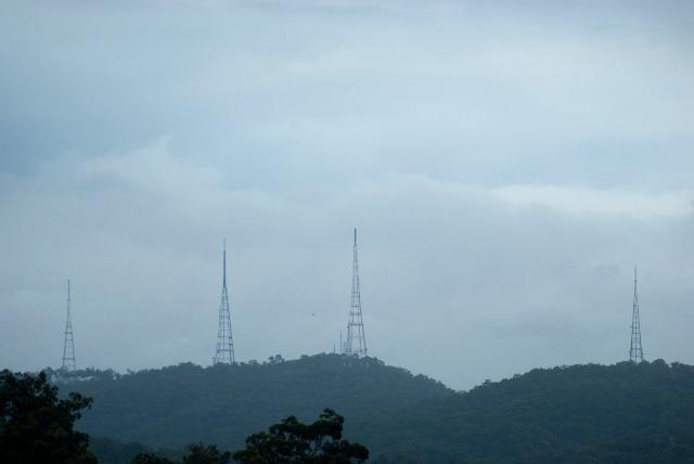Mount Coot-tha communications transmitters visible on the skyline on the highest mountain peak in proximity to Brisbane, Queensland, Australia