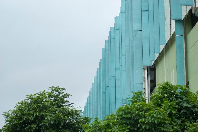 Queensland State Library exterior facade viewed over bushes in Brisbane, Queensland , Australia