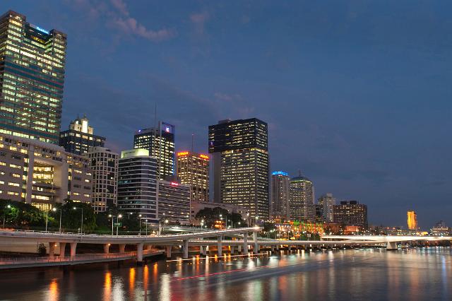Scenic view of central Brisbane at night with the colourful lights of the CBD reflected in the calm water of the Brisbane River