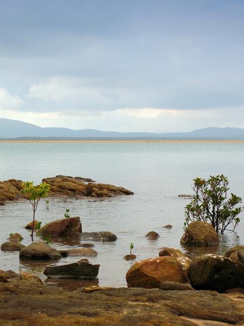 rocks and calm waters on the waterfront at town of 1770, queensland