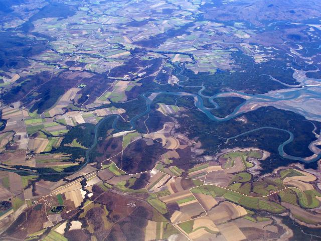 an aerial view of the murray river and surrounding farm land, north queensland