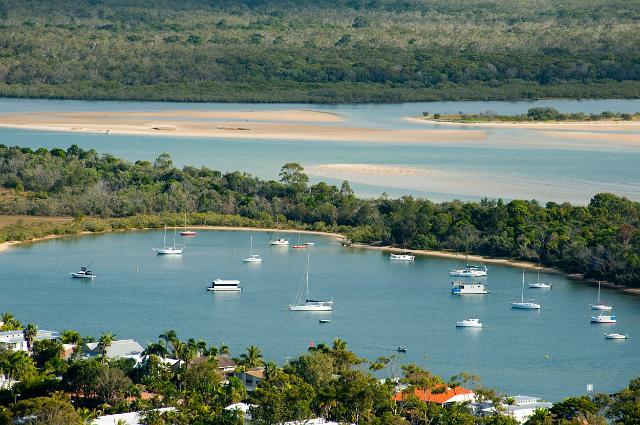 Settlement on the Noosa River in South East Queensland, Aystralia with small pleasure boats moored in a sheltered estuary in an area known for its recreational activities, water quality and bird life