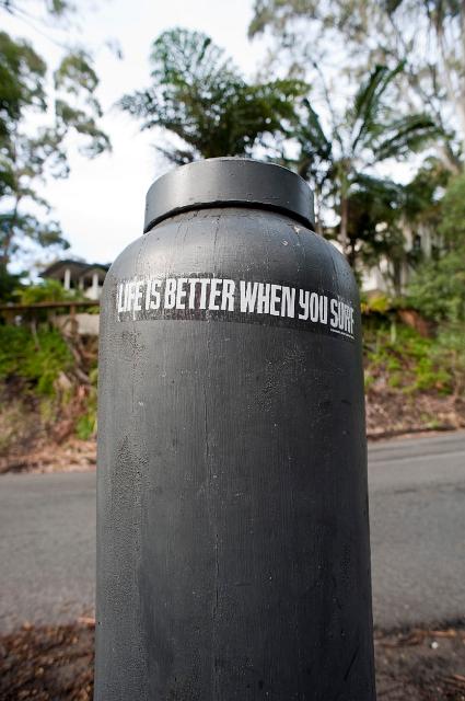 a sticker near a surf beach at noosa with lifes better when your surf written on it