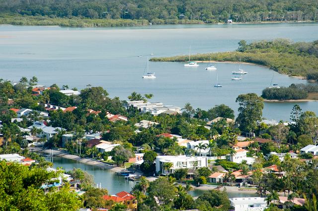 Luxury houses on the waterfront at Noosa, Queensland, Australia nestling in lush trees on the banks of the Noosa River