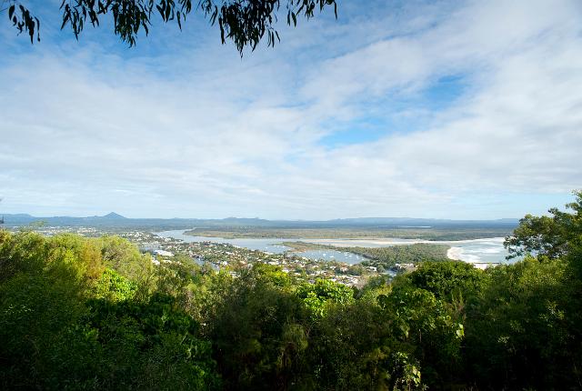Noosa panorama showing the estuary of the Noosa River amongst lush tropical vegetation and a portion of the coastline as it enters the ocean