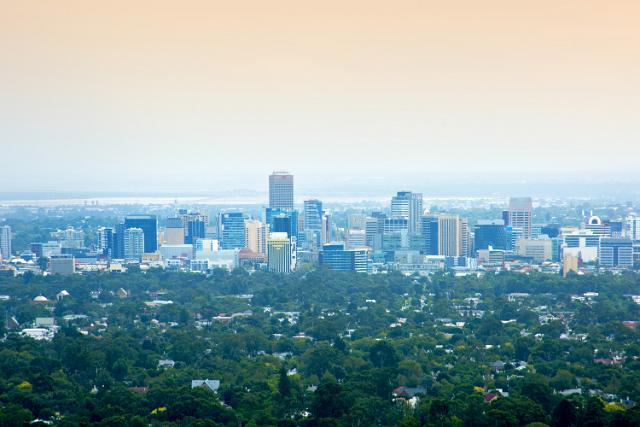 The skyline of Adelaide, capital if South Australia looking across the leafy green suburbs to the skyscrapers and high-rise buildings of the CBD