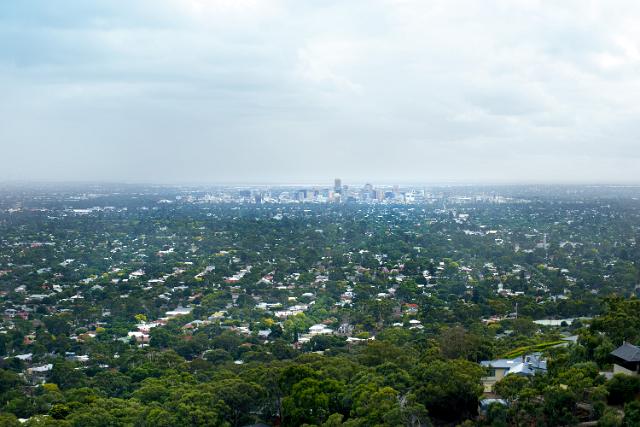 Distance landscape view of the city of Adelaide, South Australia showing the topography and the leafy green suburbs with the CBD in the background on the horizon