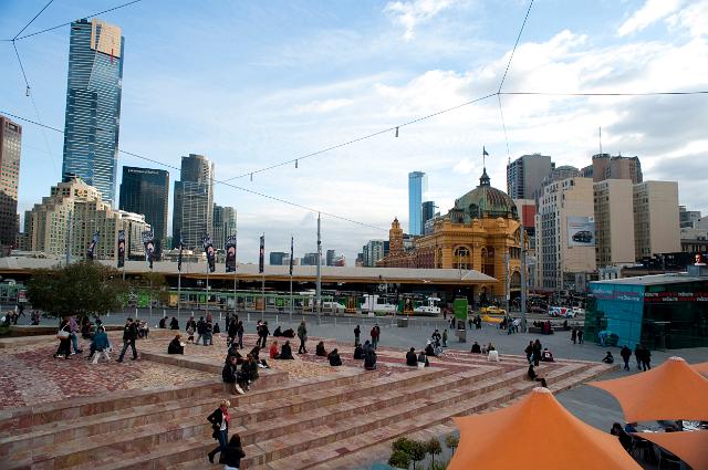 People relaxing in Federation Square, Melbourne, Australia which is a civic precinct covering several hectares in the centre of the city providing recreational activities