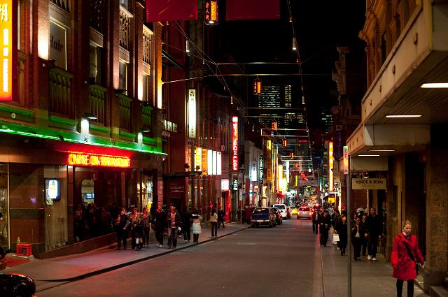 Night scene in Little Bourke St, China Town , Melbourne with its colourful neon lights and nightlife as shoppers walk the street