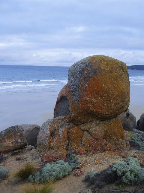 colourful rock boulders standing on a headland above squeaky beach and wilsons promontory