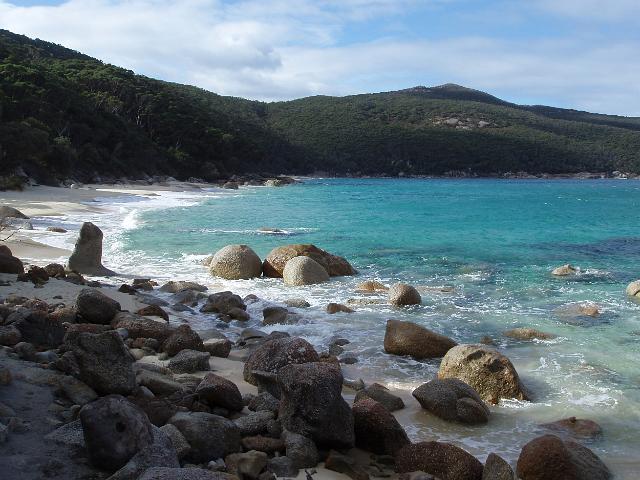 sandy beach and rounded rock boulders at waterloo bay